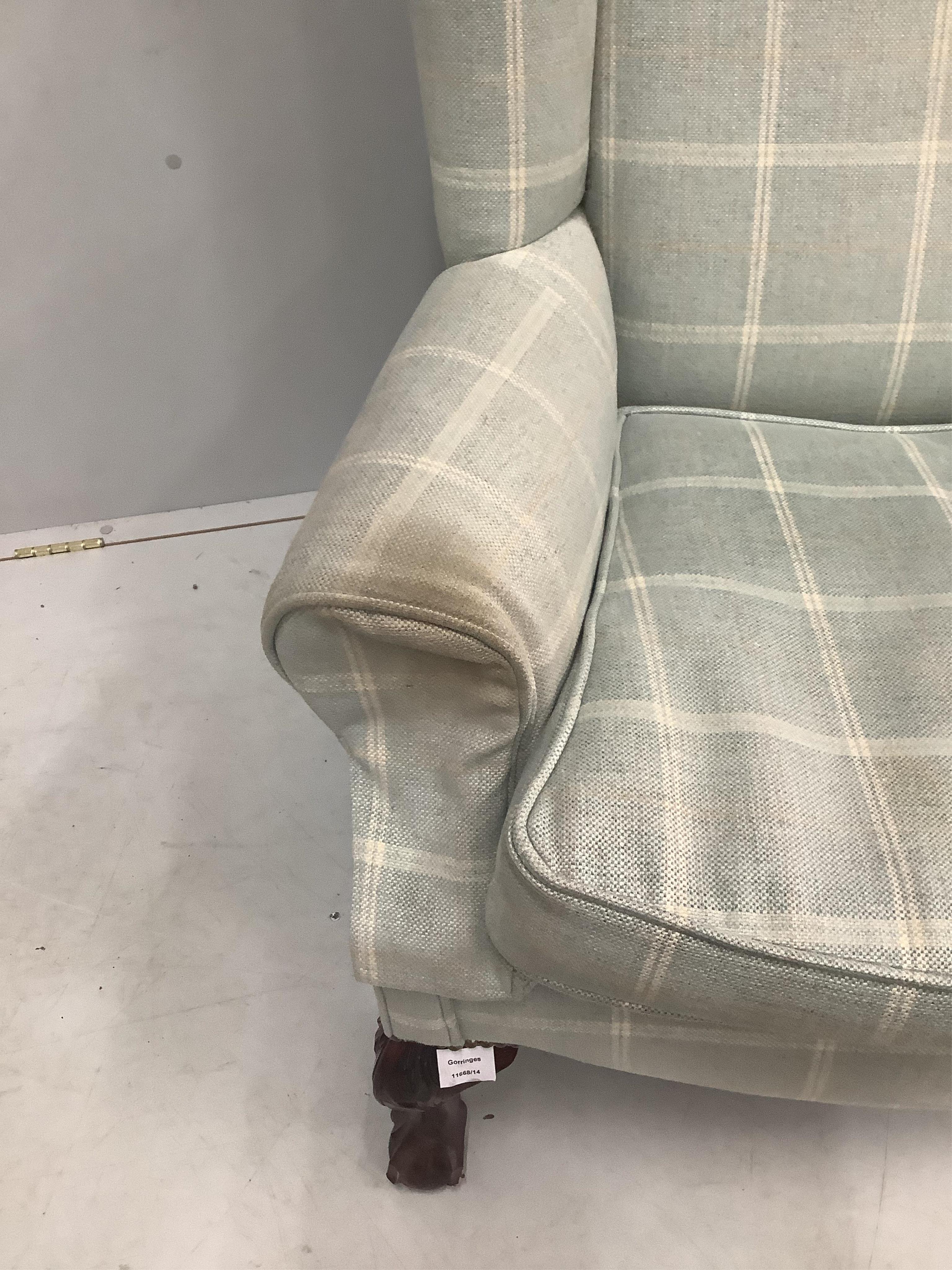 A George I styles upholstered wingback armchair, width 79cm, depth 76cm, height 120cm. Condition - fair